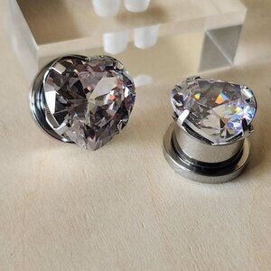Silver stainless steel diamond heart CZ plugs.